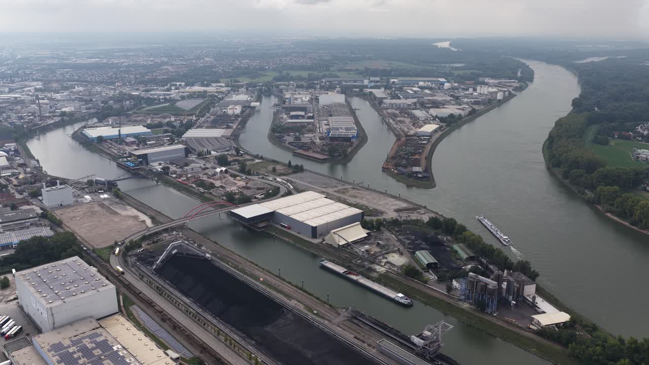 Industriehafen Mannheim, aerial video on cloudy day. Rhine river in Germany