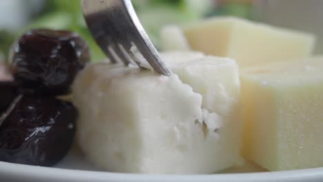 close-up of cheese and olives