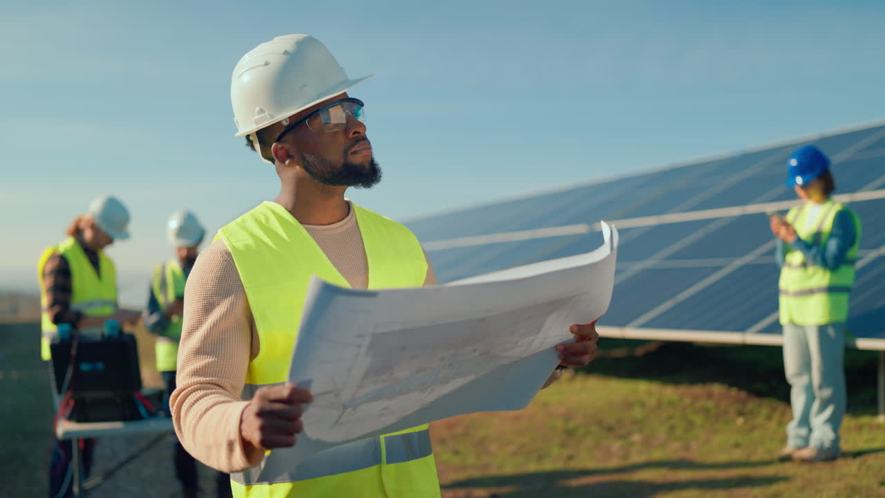 Engineers Inspecting Solar Panel Construction
