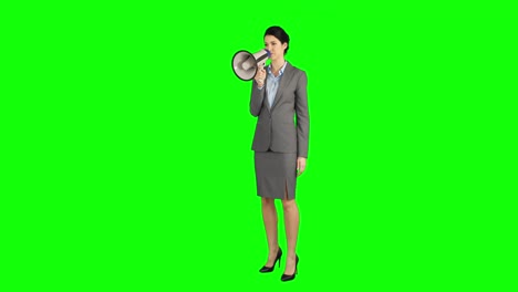 Pretty-businesswoman-shouting-with-megaphone