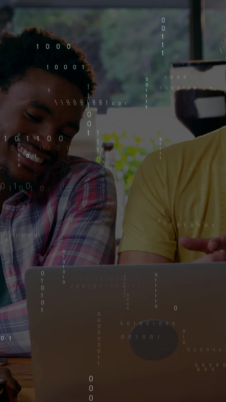 Vertical video: Binary overlay starting left leaning laughing, right pointing, working on laptop