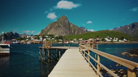 walking on a wooden deck enjoying the breathtaking view of the reine in the lofoten islands, norway.