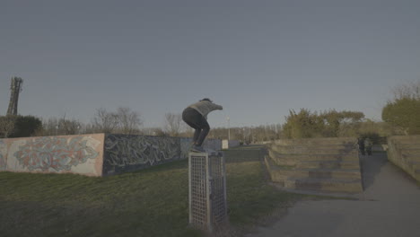 person performing freestyle jump in a park