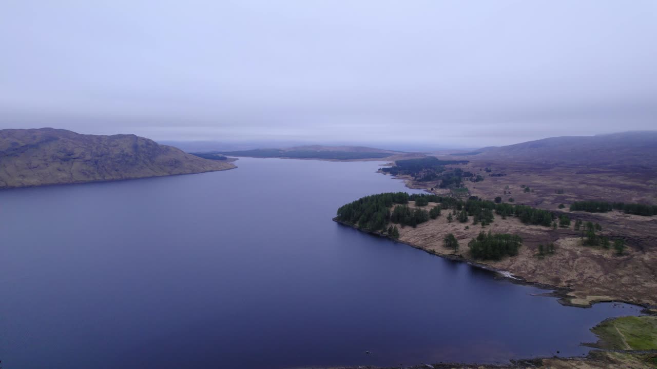 great big lake in Scotland surrounded by small forests and swampland