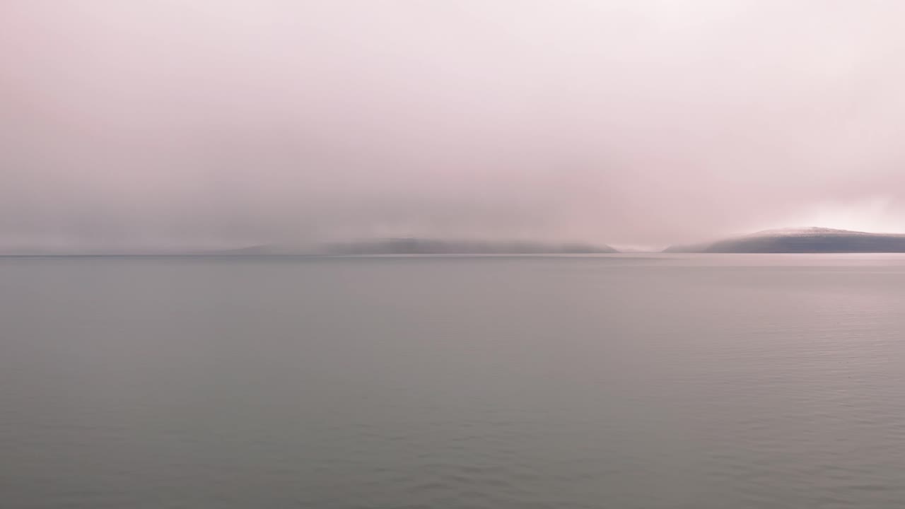 Drone Flying Over Mist Covered Beach In Westfjords Iceland - aerial shot