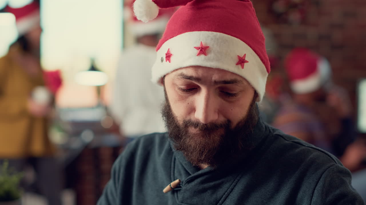 Startup employee working on laptop during winter holiday