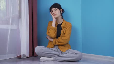 depressed young woman shaking her head with negative expression.