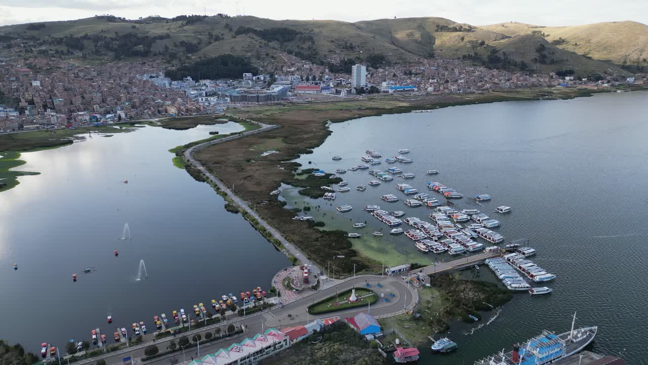 Morning flyover lagoon and marina on Lake Titicaca at Puno, Peru
