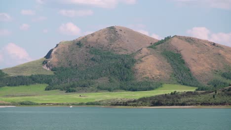 A-boat-floats-on-the-Blackfoot-Reservoir-in-Caribou-County-Idaho-on-a-lazy-summer-day