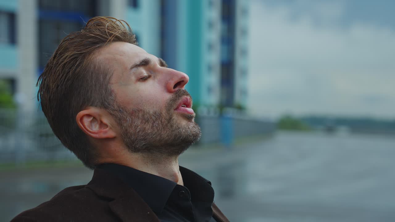 Man looking sad in the rain