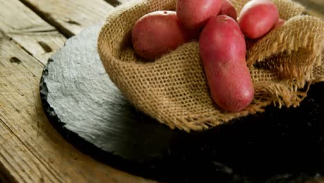 sweet potatoes on a sack 4k