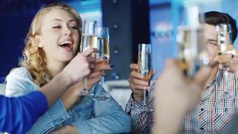 Young-People-Relax-At-A-Table-In-A-Cozy-Restaurant-While-They-Talk-And-Have-A-Good-Time-6