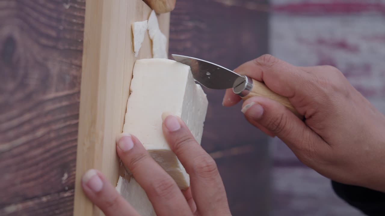 Cutting cheese with a knife