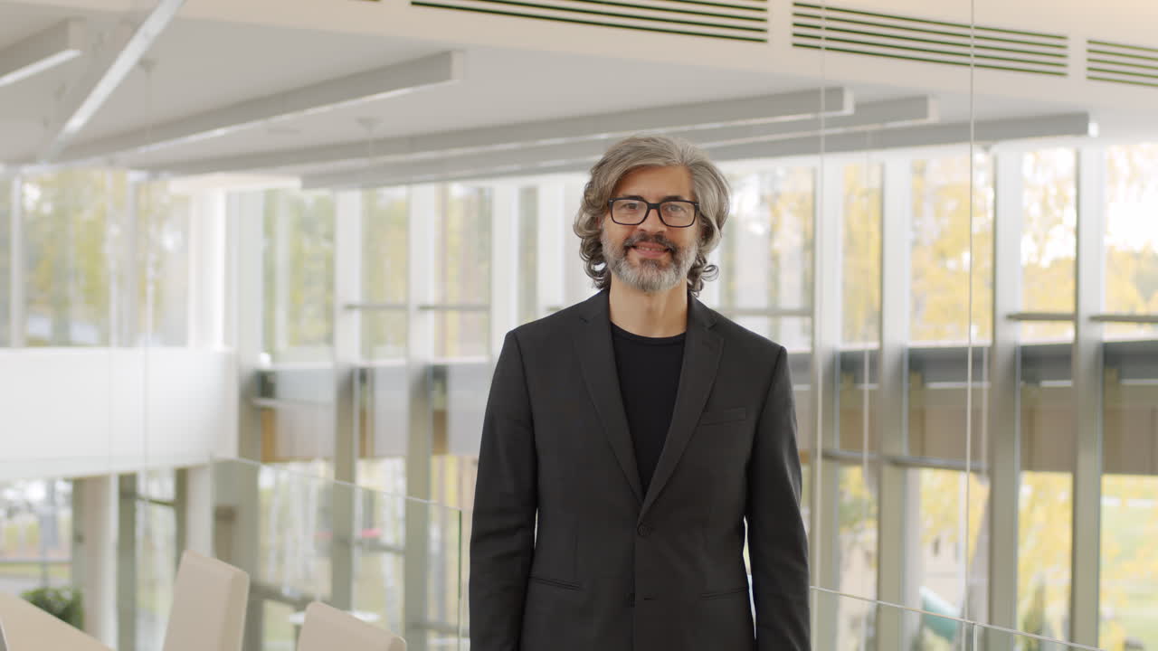 Portrait Of Smiling Businessman With Smartphone