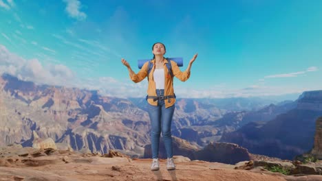 full body of asian female hiker with mountaineering backpack spreading arms enjoy looking the view around while traveling at the top of mountain