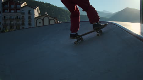 skateboarding in a city park with mountains in the background