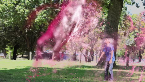 man holding soccer ball and boy clasping hands in park, showing powder effect for sports marketing