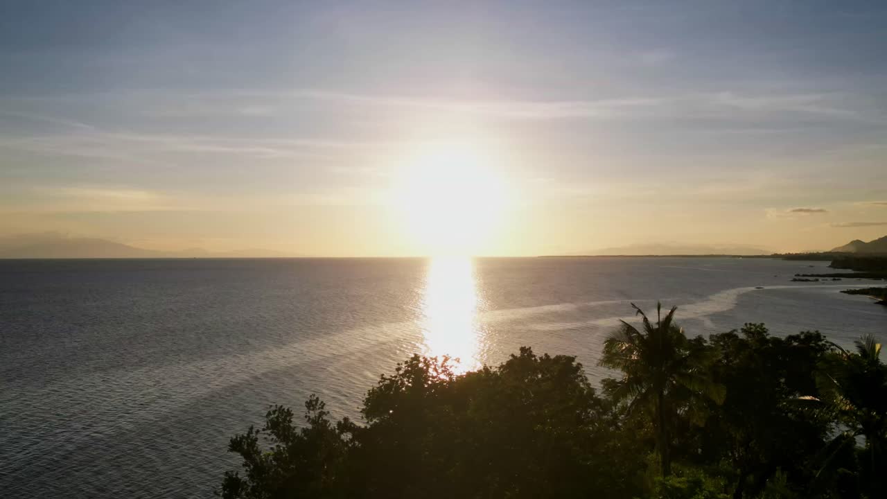 Aerial forward hyperlapse of picturesque sunset and ocean horizon during dusk at Catanduanes, Philippines