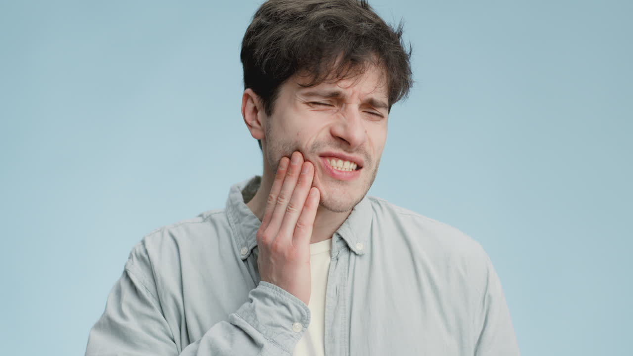Man experiencing tooth pain