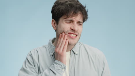 man experiencing tooth pain