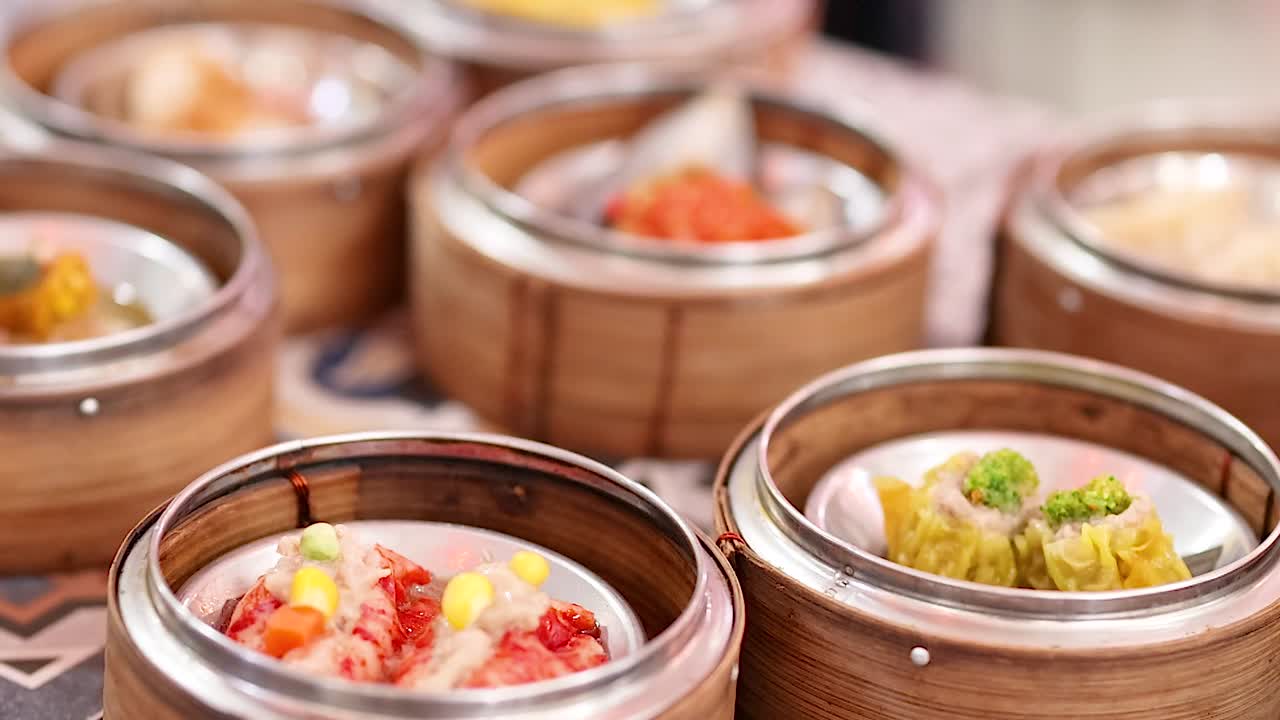 A detailed view of dim sum dishes in bamboo steamers, highlighting vibrant colors and textures.