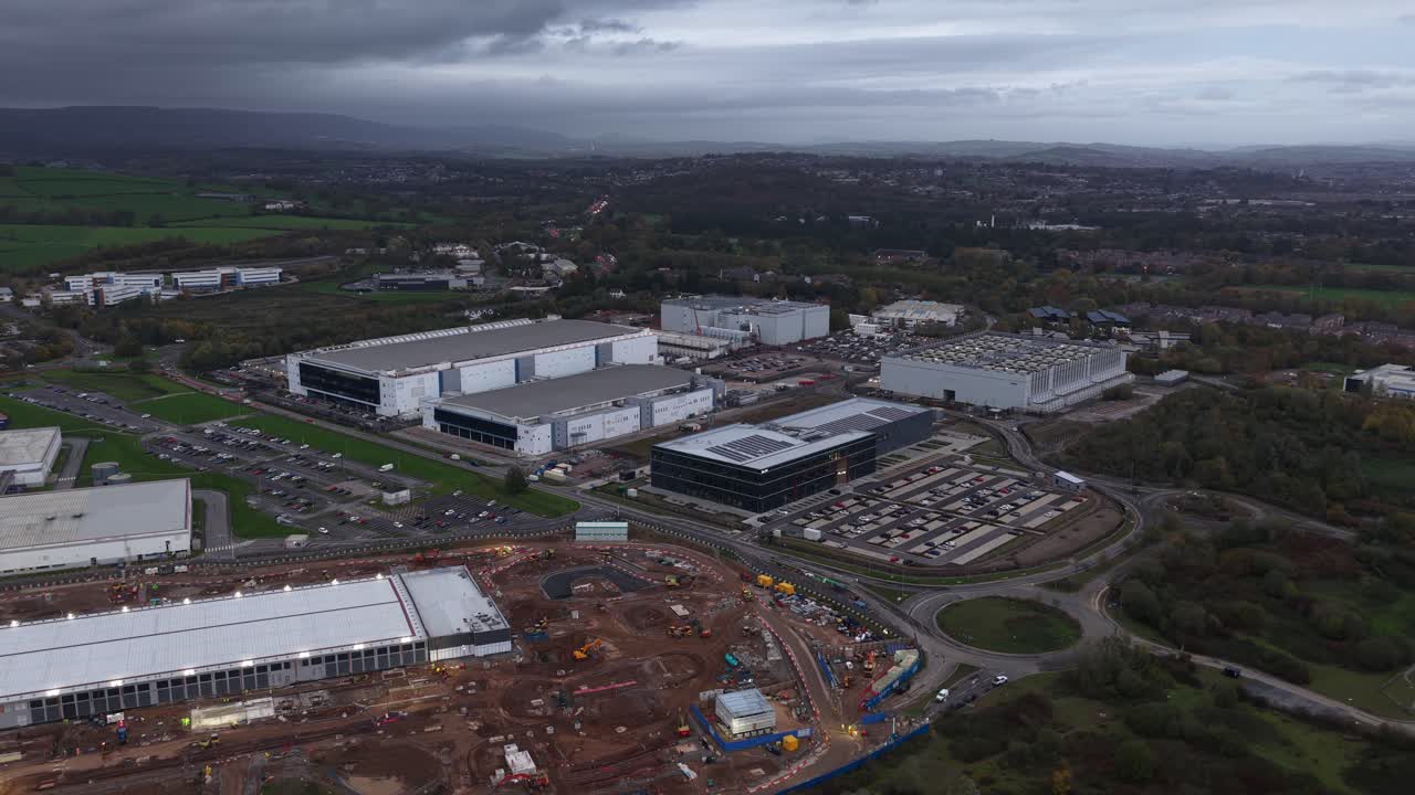 Aerial drone view of a huge commercial hyperscale data center campus near Cardiff, Wales, showing digital infrastructure, AI growth, construction, and large scale technology expansion