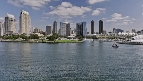 San-Diego-California-Aerial-v45-flyover-embarcadero-marina-park,-flying-through-in-between-hotel-building-complex-capturing-east-village-downtown-cityscape---Shot-with-Mavic-3-Cine---September-2022