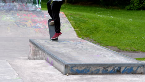 young skateboarder skating the outdoor skatepark