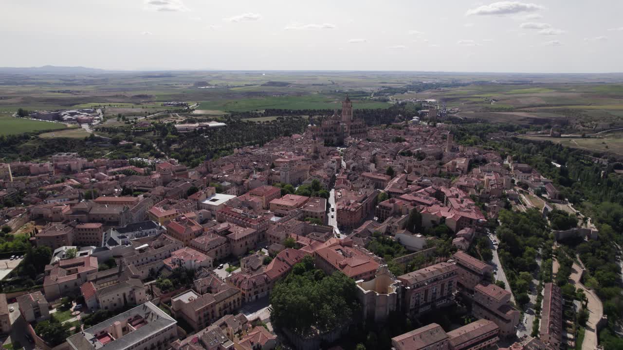 Flyover Segovia's cityscape, with Majestic Cathedral in the backdrop, Spain
