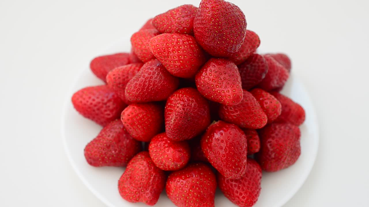 Strawberry on a white background, isolate. Shooting in the movement