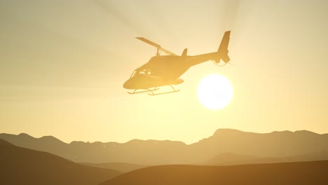 extreme slow motion flying helicopter and sunset sky