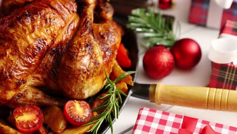 Roasted-whole-chicken-or-turkey-served-in-iron-pan-with-Christmas-decoration