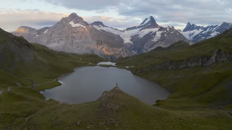 Aerial-Swiss-mountain-Alps,-Person-is-enjoying-the-view,-Grindelwald