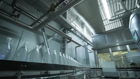 conveyor belt with bottles of drinking water at a modern beverage plant