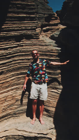 man exploring a canyon