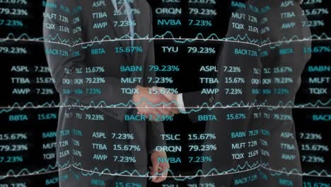 Stock-market-data-processing-against-mid-section-of-two-businessmen-shaking-hands