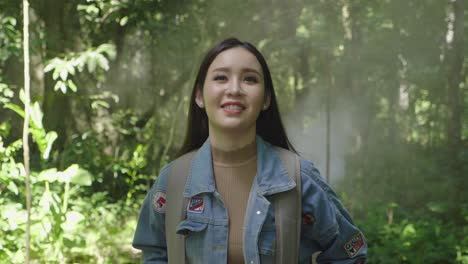 pretty asian girl walking in the forest, slow motion