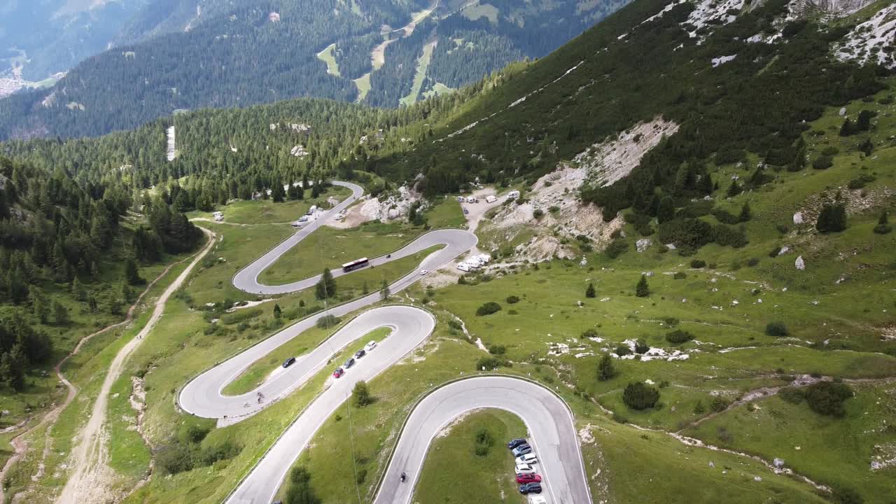 Pordoi Mountain Pass at Trentino, South Tyrol, Dolomites, Italy - Aerial Drone View of Hairpin Curves and Mountains