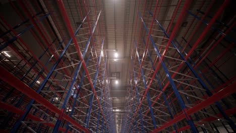 big and modern warehouse under construction, featuring metal shelving and other industrial equipment.