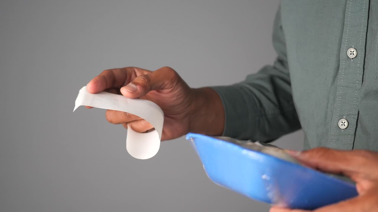 Hand holding food package and label