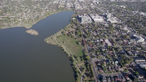 a 4k high-flying drone shot of sloan’s lake, the biggest lake in the city of denver, colorado, and home to the second largest park in the city, and a myriad of outdoor activities