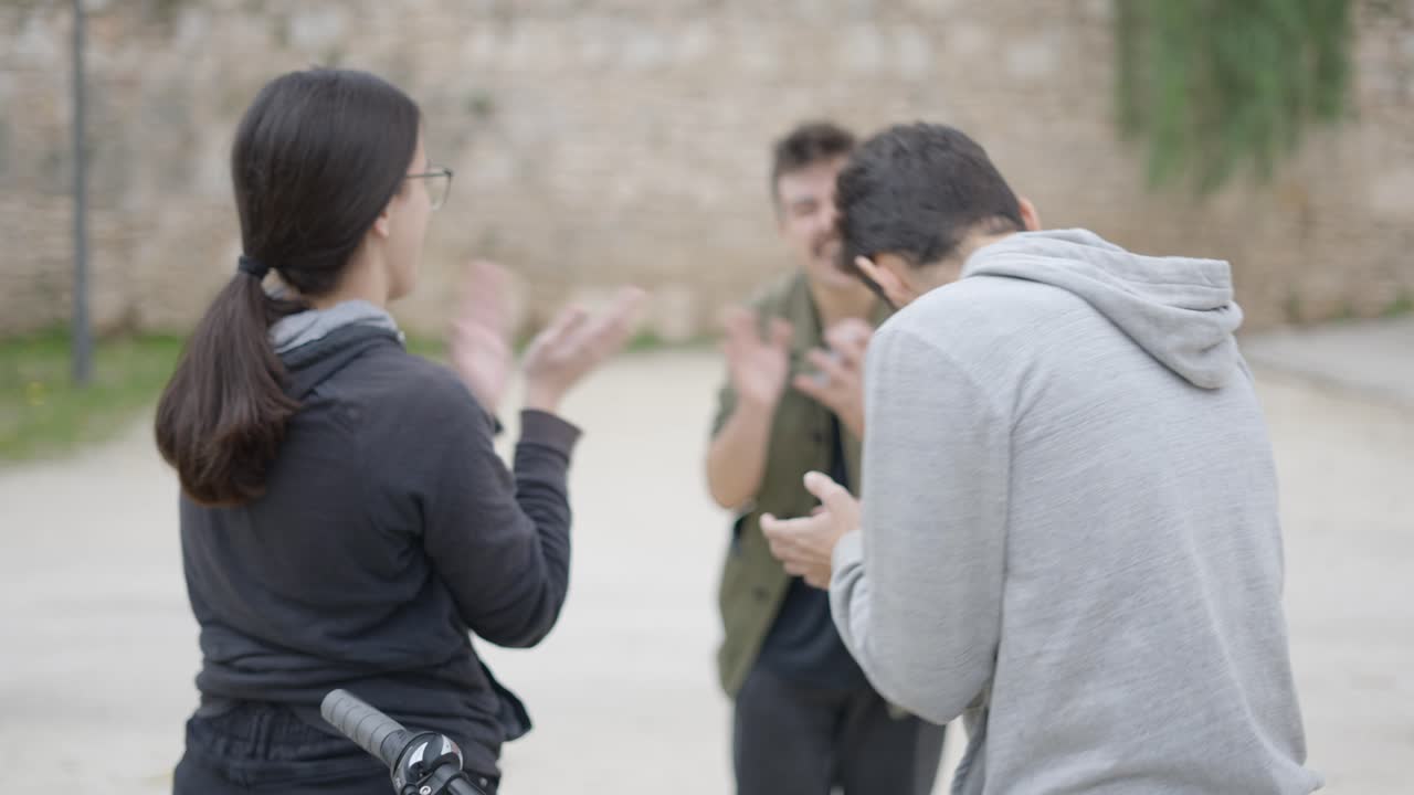 Friends playing a card game outdoors