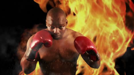 boxeador duro golpeando con guantes rojos