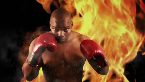 tough boxer punching with red gloves