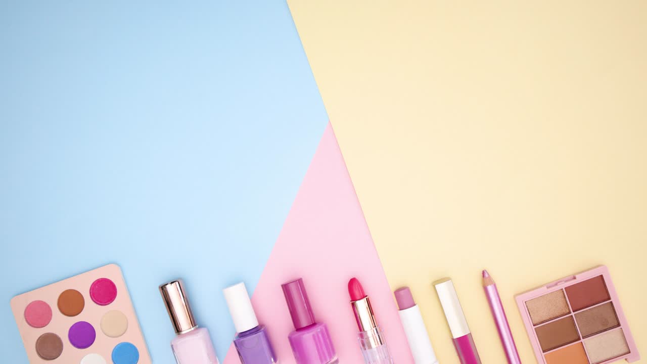 Pastel make up move from left to right on bottom of pastel background - Stop motion