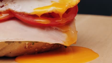 bagel sandwich brunch, lunch plate of a bagel with smoked salmon and cream cheese and ham, close up morning cafe menu.