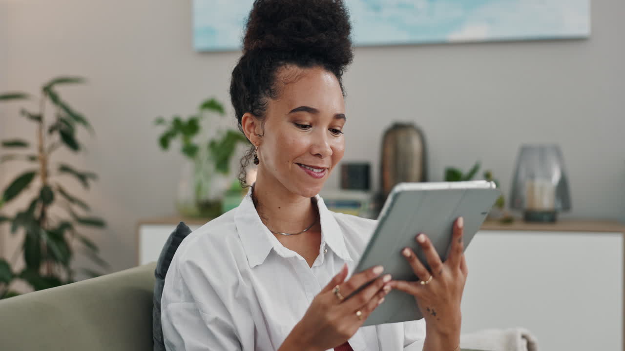 Woman Using Tablet in Living Room