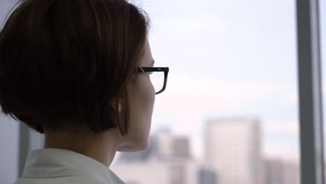 woman looking out of a window