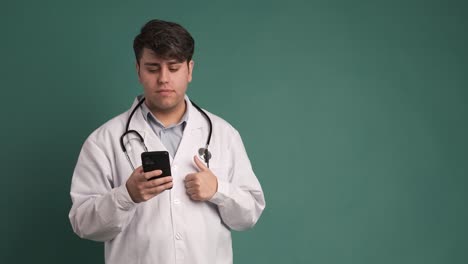 smile and doctor with smartphone for wellness research, medical app, on green background