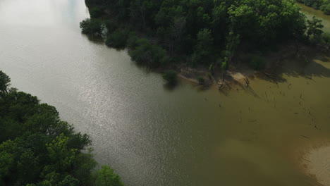 Aerial-View-Over-River-And-Vegetation-In-Twin-City-Riverfront-Park,-Arkansas,-USA---drone-shot